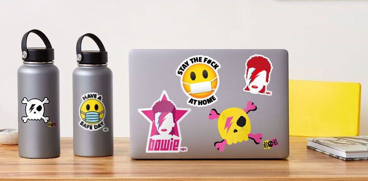 Bowie, skulls and covid stickers on laptop and water bottles